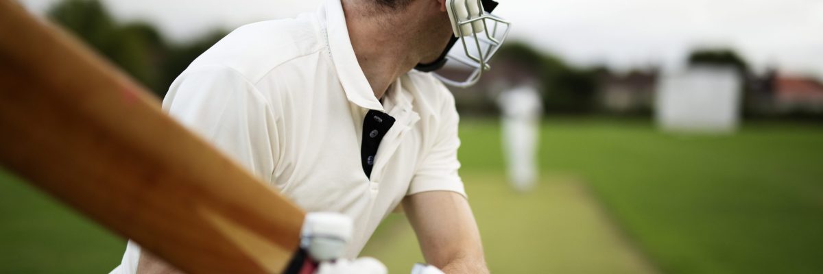 Cricketer on the field in action